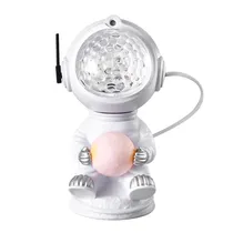 Caixa de Som / Spekear com Luminaria Astronauta Nebula Sentado Projetor com Controle Incluido - Branco
